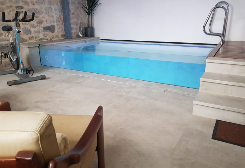 Defelma-piscina-interior-obra-transparente-lateral